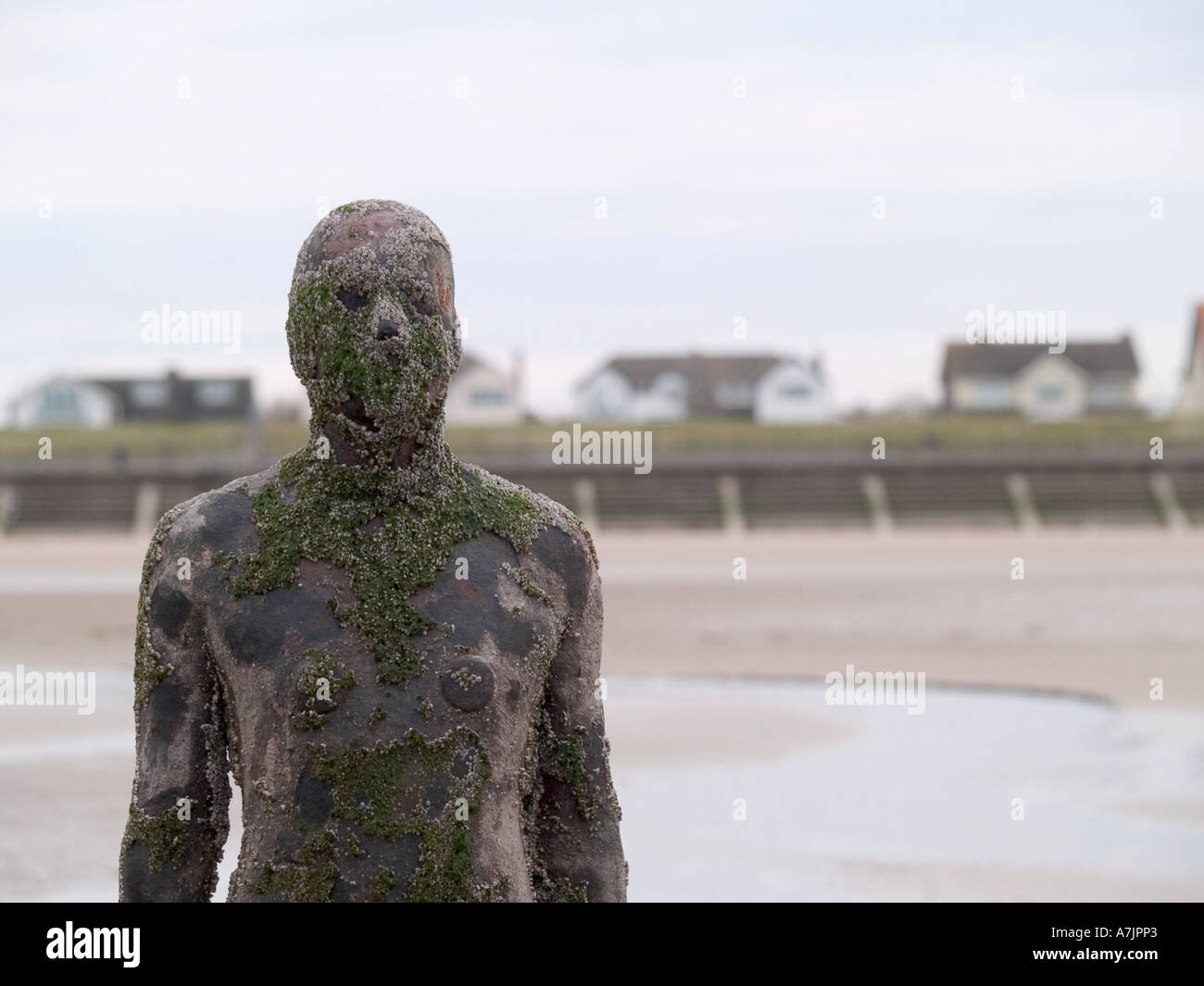 ANTONY GORMLEY SCULPTURED FIGURES ON BEACH AT CROSBY, LIVERPOOL