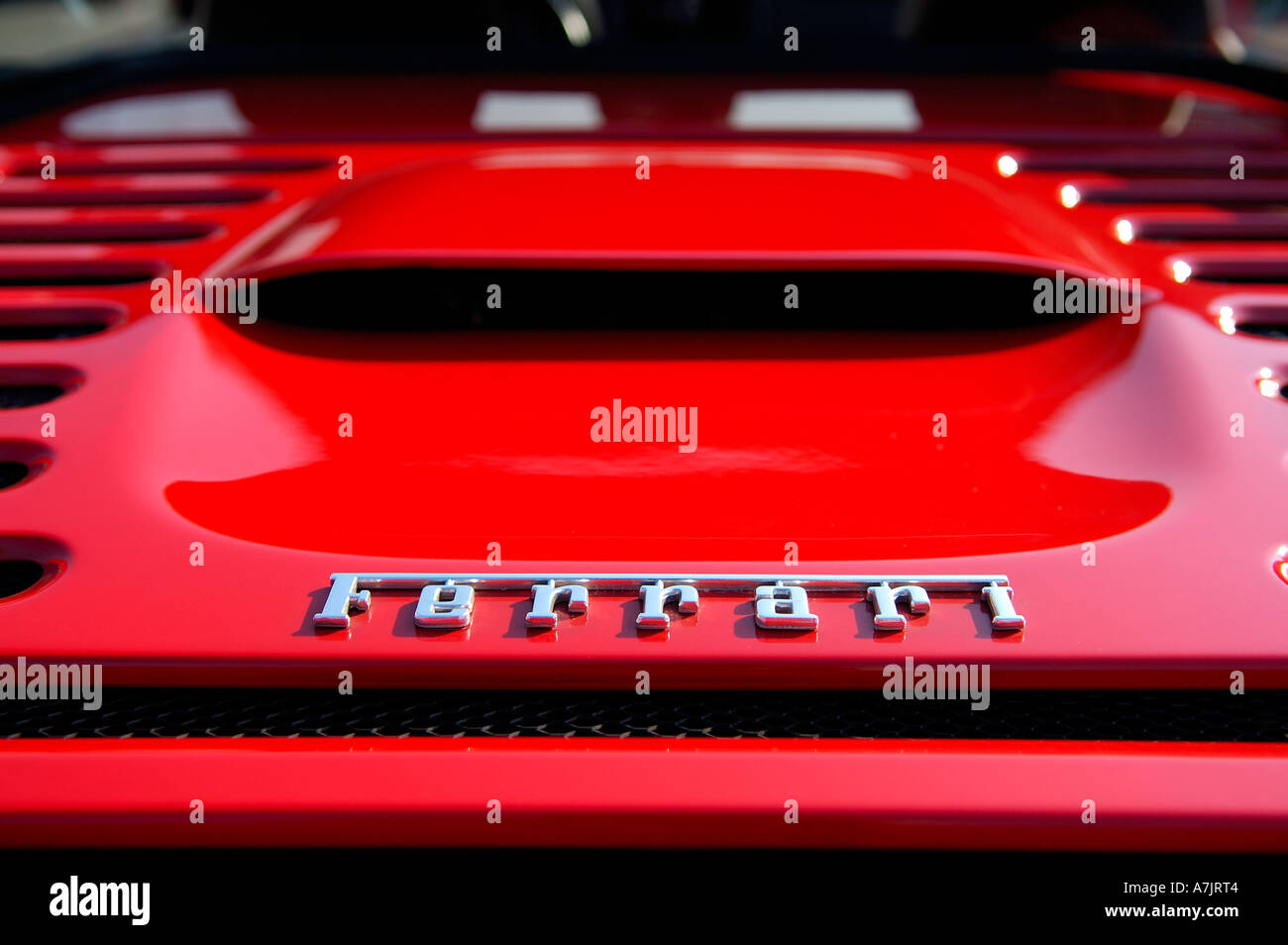 Logo on the engine hood of a red Ferrari sportscar Stock Photo Alamy