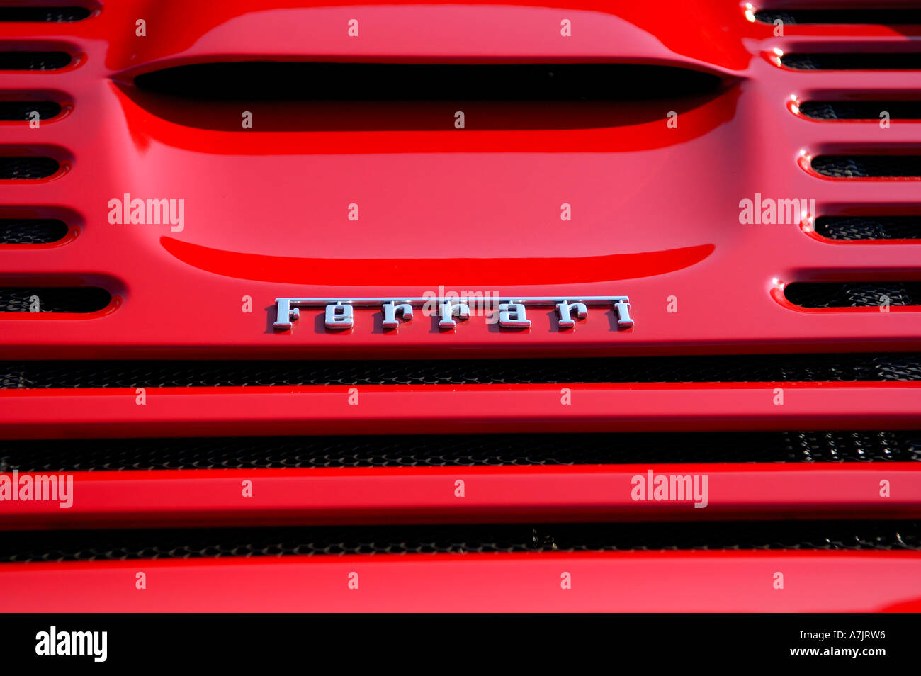 Logo on the engine hood of a red Ferrari sportscar Stock Photo - Alamy