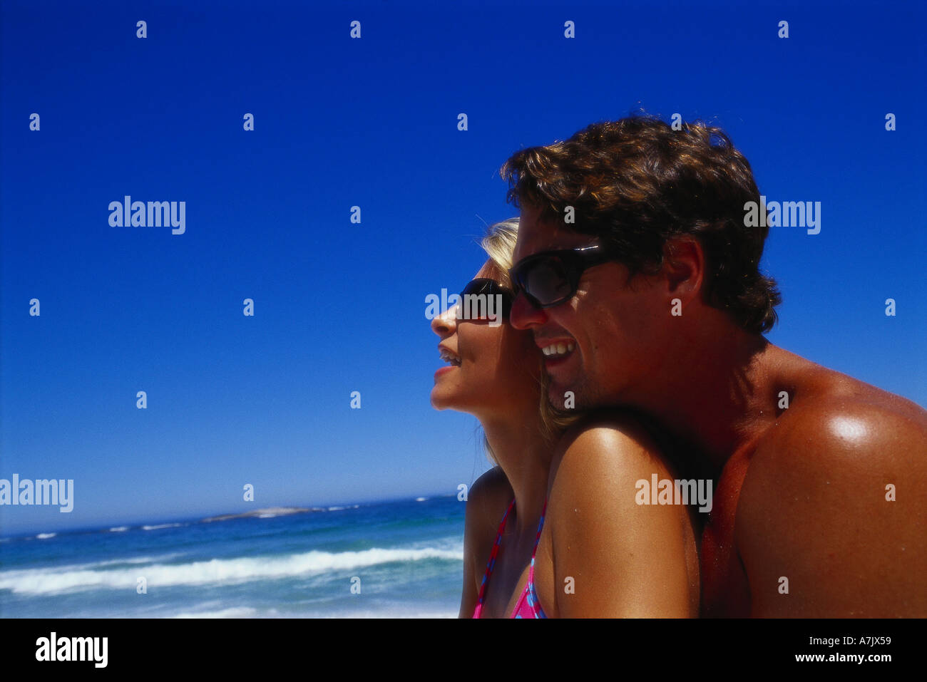 Beach Rode Side Profile Side profile of a young couple on the beach Stock Photo - Alamy