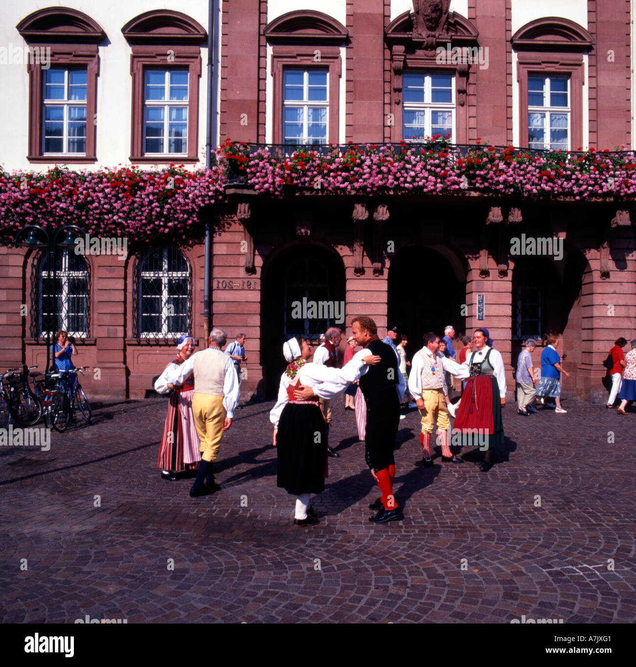 Folk dancing on a street in the German city of Heidelberg. Stock Photo