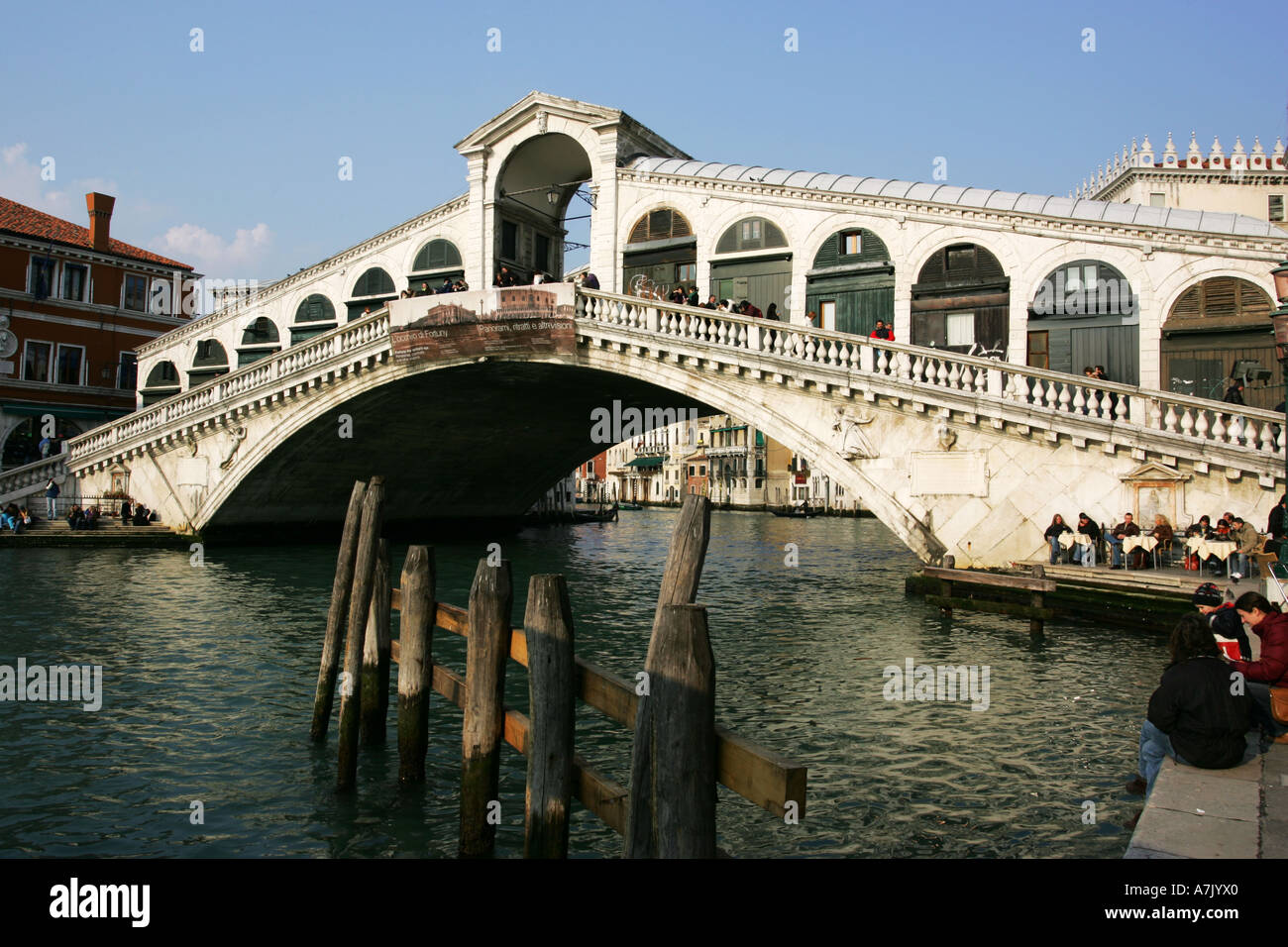 Popular tourist attraction the Ponte di Rialto Bridge spans the Grand Canal Venice Italy European destination EU Stock Photo