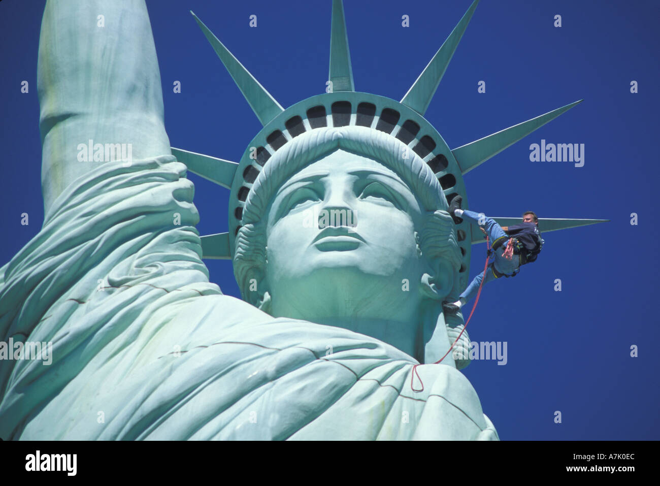 maintenance man repelling on Statue of Liberty at New York New York