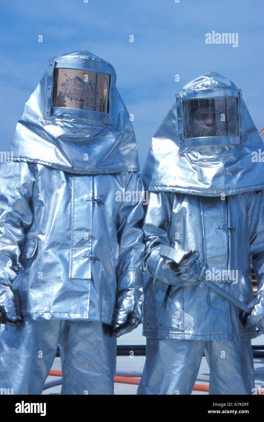 firefighters in heat resistant suits Stock Photo - Alamy