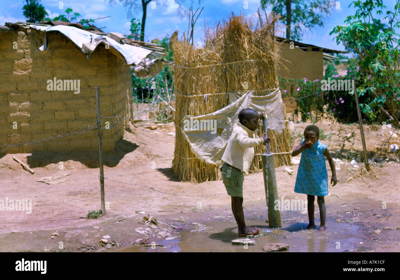 Zambia Shanty Town Water Tap Children Drinking Stock Photo Alamy