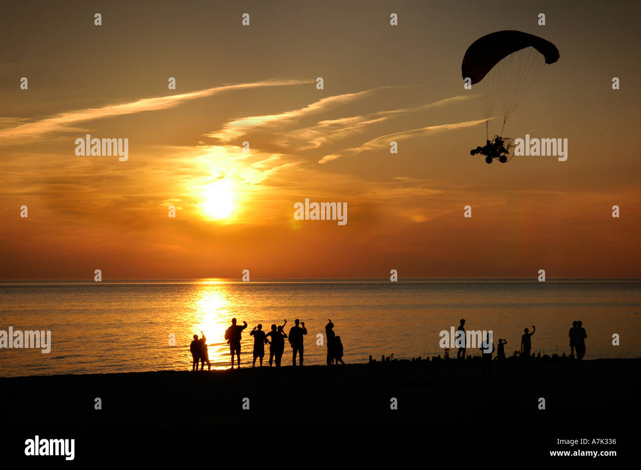 Lake Michigan sunset and ultralight plane Stock Photo Alamy