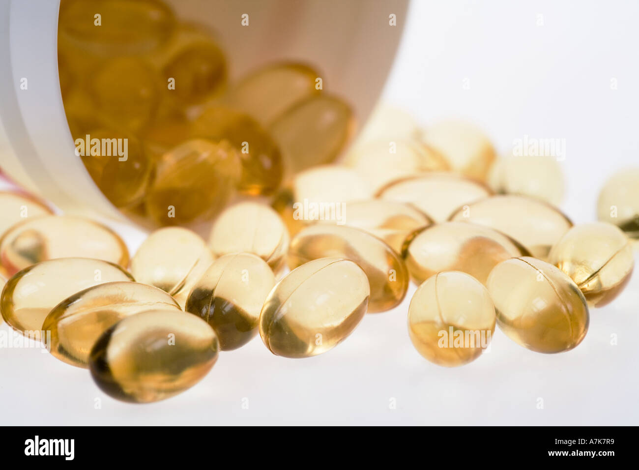 Pills filled with fish oil Omega 3 capsules on white background Stock Photo