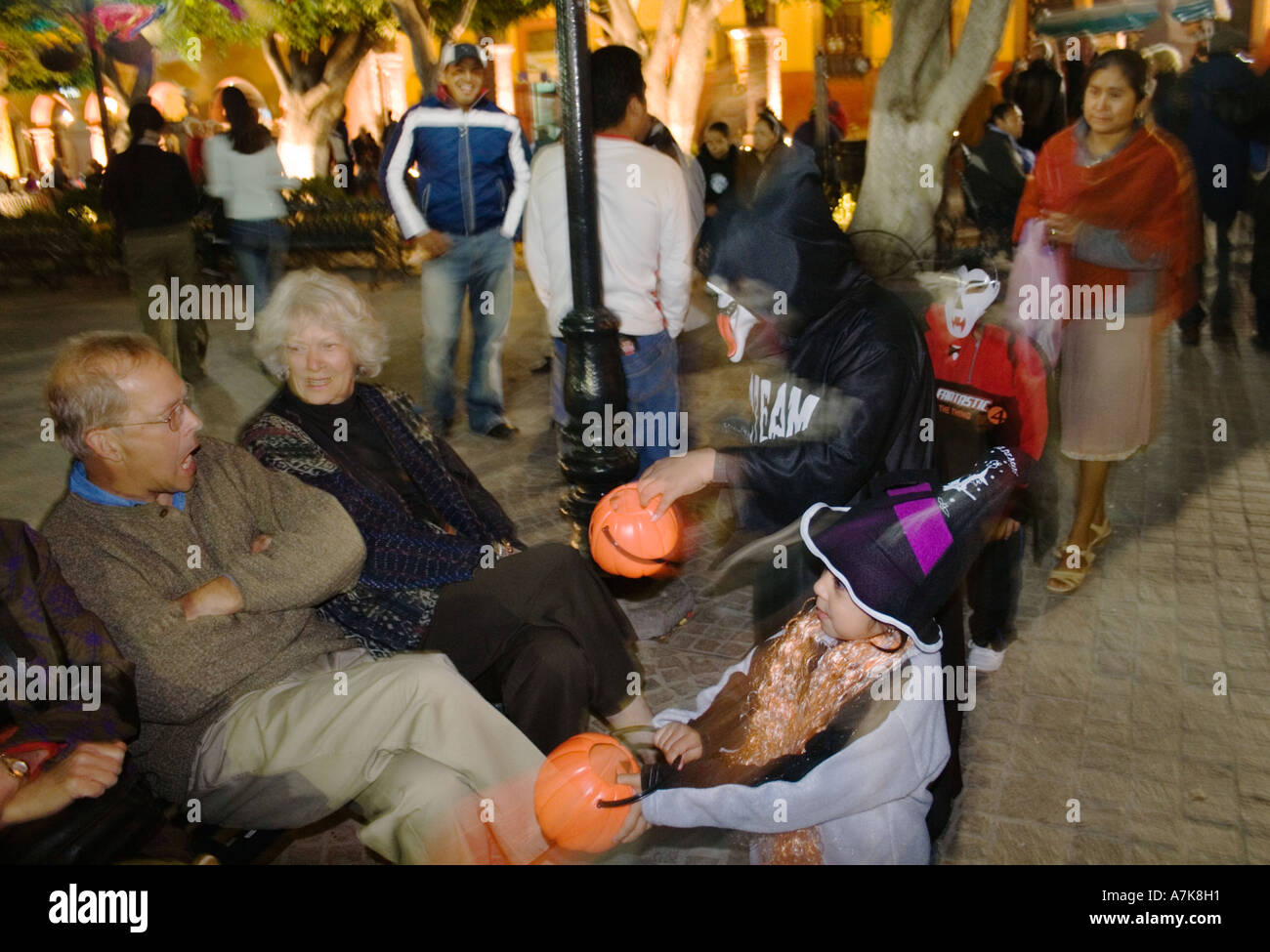 MEXICAN children trick or treat in the JARDIN during the DEAD OF THE DEAD SAN MIGUEL DE ALLENDE MEXICO Stock Photo