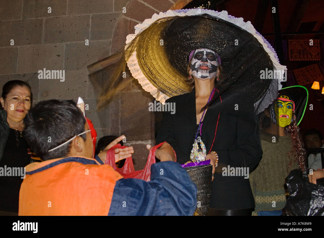 Adults dress up as skeletons during the DEAD OF THE DEAD SAN MIGUEL DE ALLENDE MEXICO Stock Photo