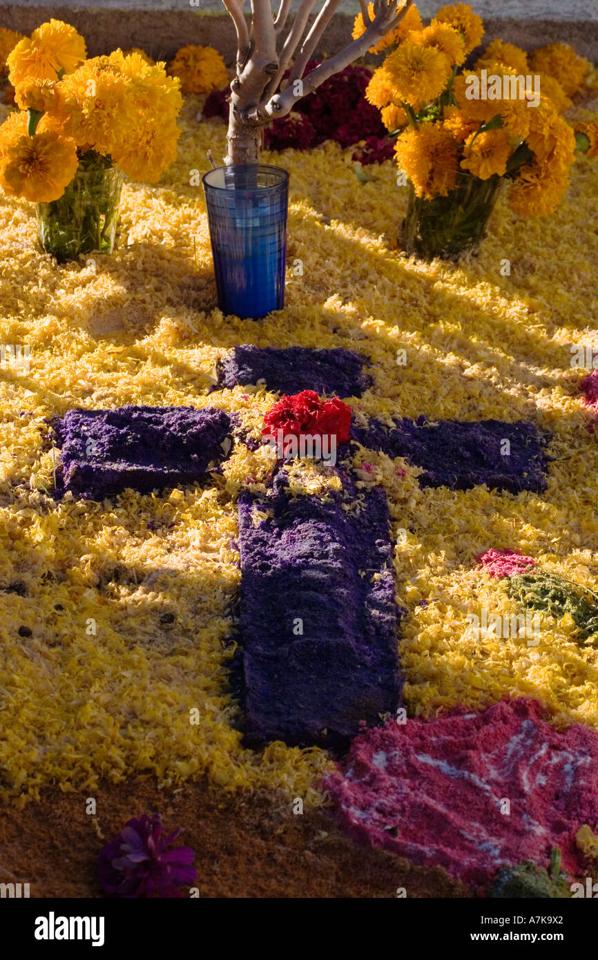 A FLOWER covered grave at the local cemetery during the DEAD OF THE DEAD SAN MIGUEL DE ALLENDE MEXICO Stock Photo