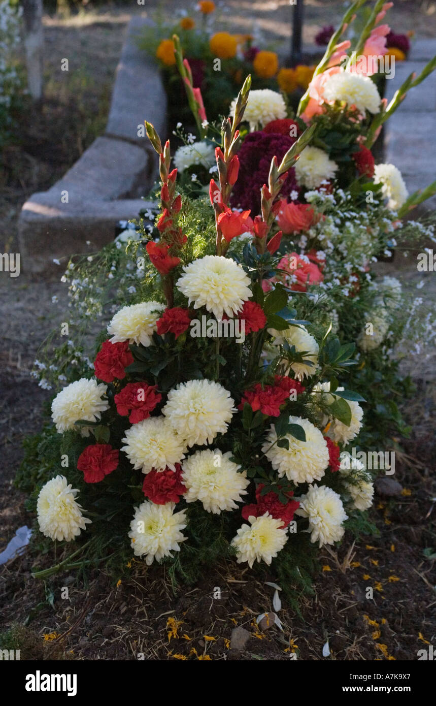 FLOWER arrangement on a grave at the local cemetery during the DEAD OF THE DEAD SAN MIGUEL DE ALLENDE MEXICO Stock Photo