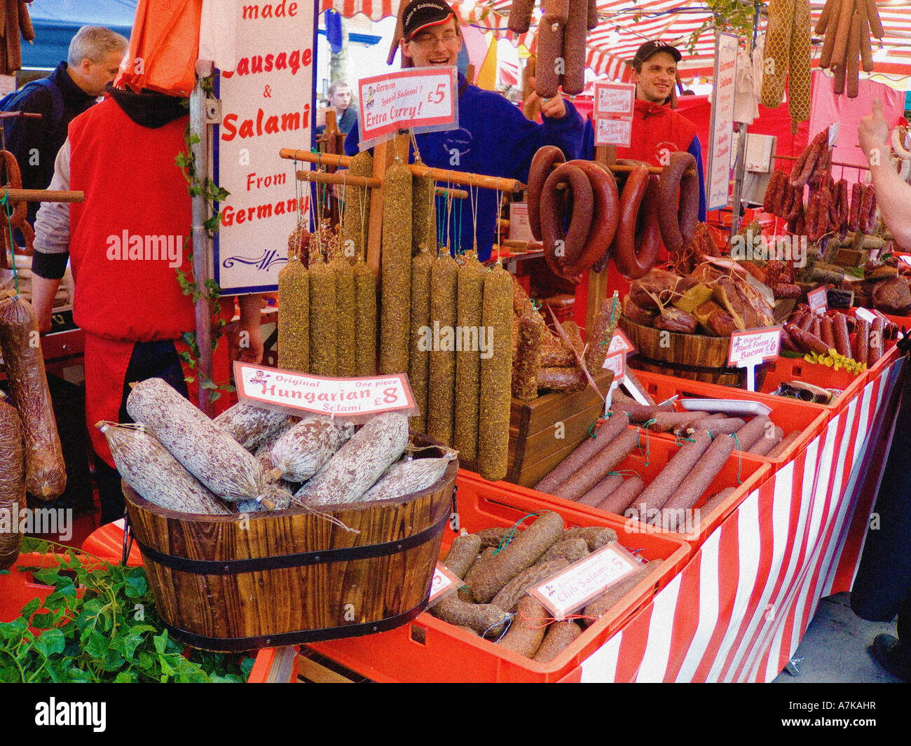Traditional open-air continental market stall selling German sausage and salami. York UK Stock Photo