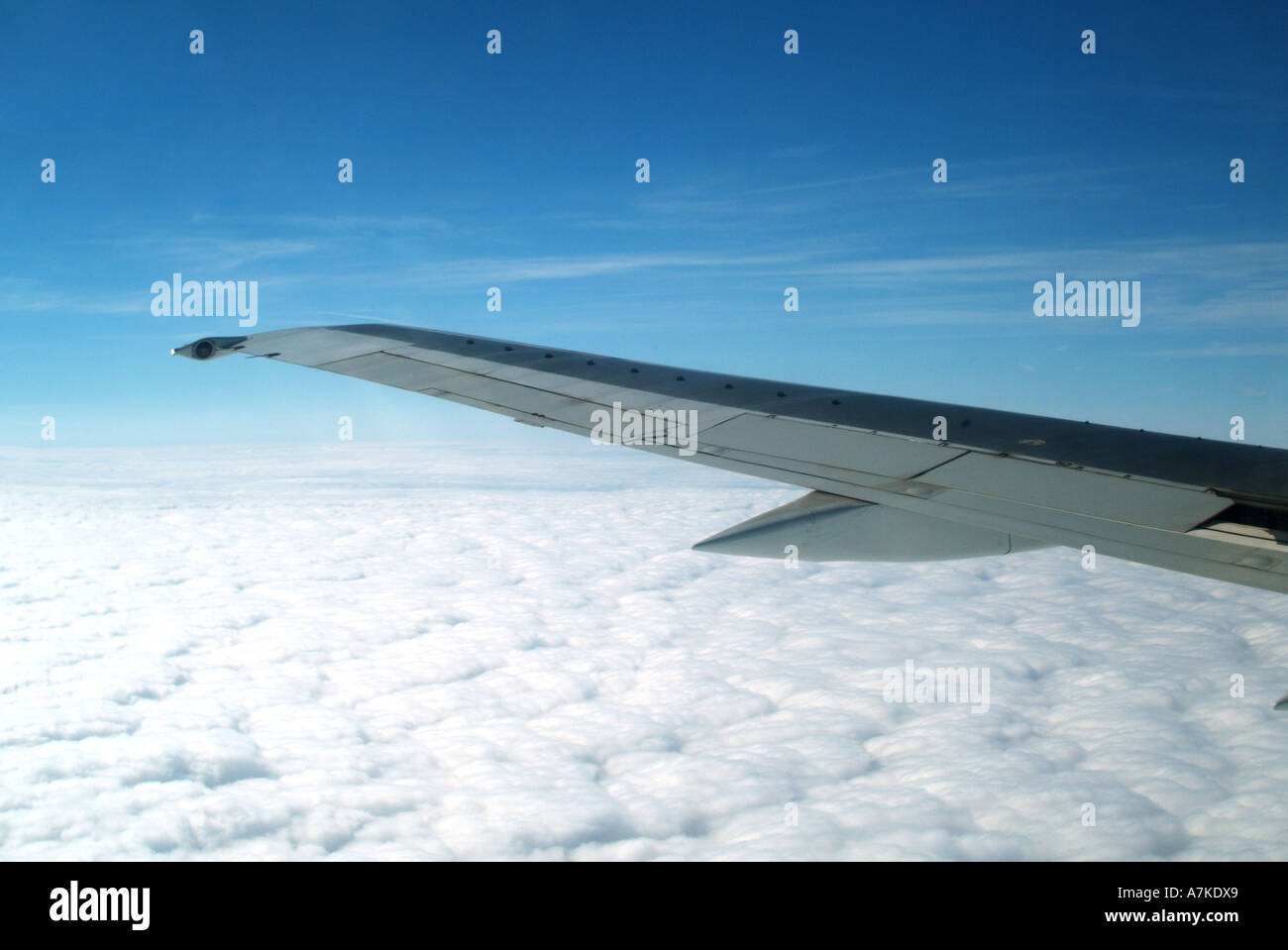 View out of passenger jet aircraft window flying above dense cloud ...