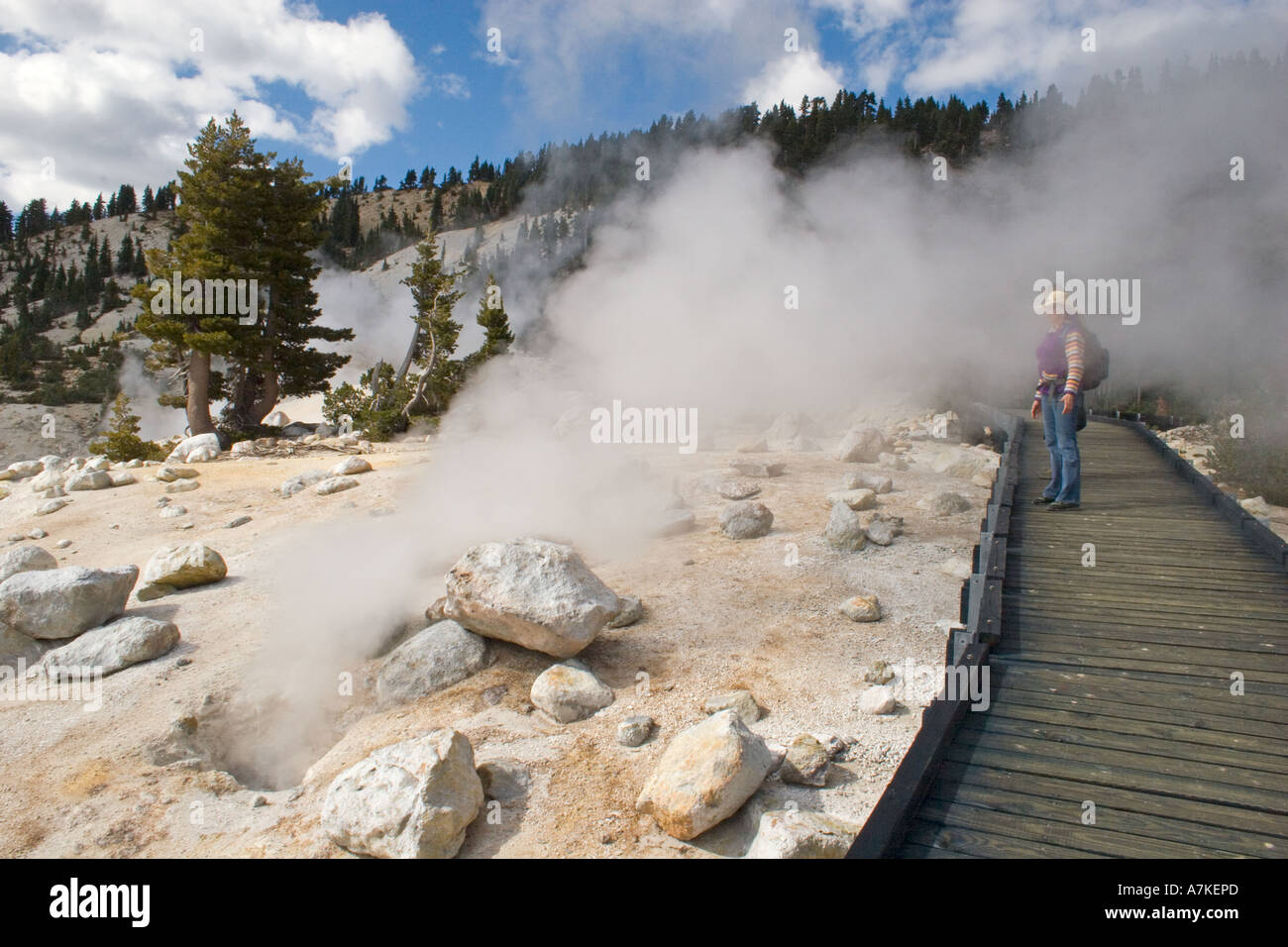 Steam engulfs Christine Kolisch  at the hot sulphur springs of BUMPASS HELL LASSEN NATIONAL PARK CALIFORNIA Stock Photo