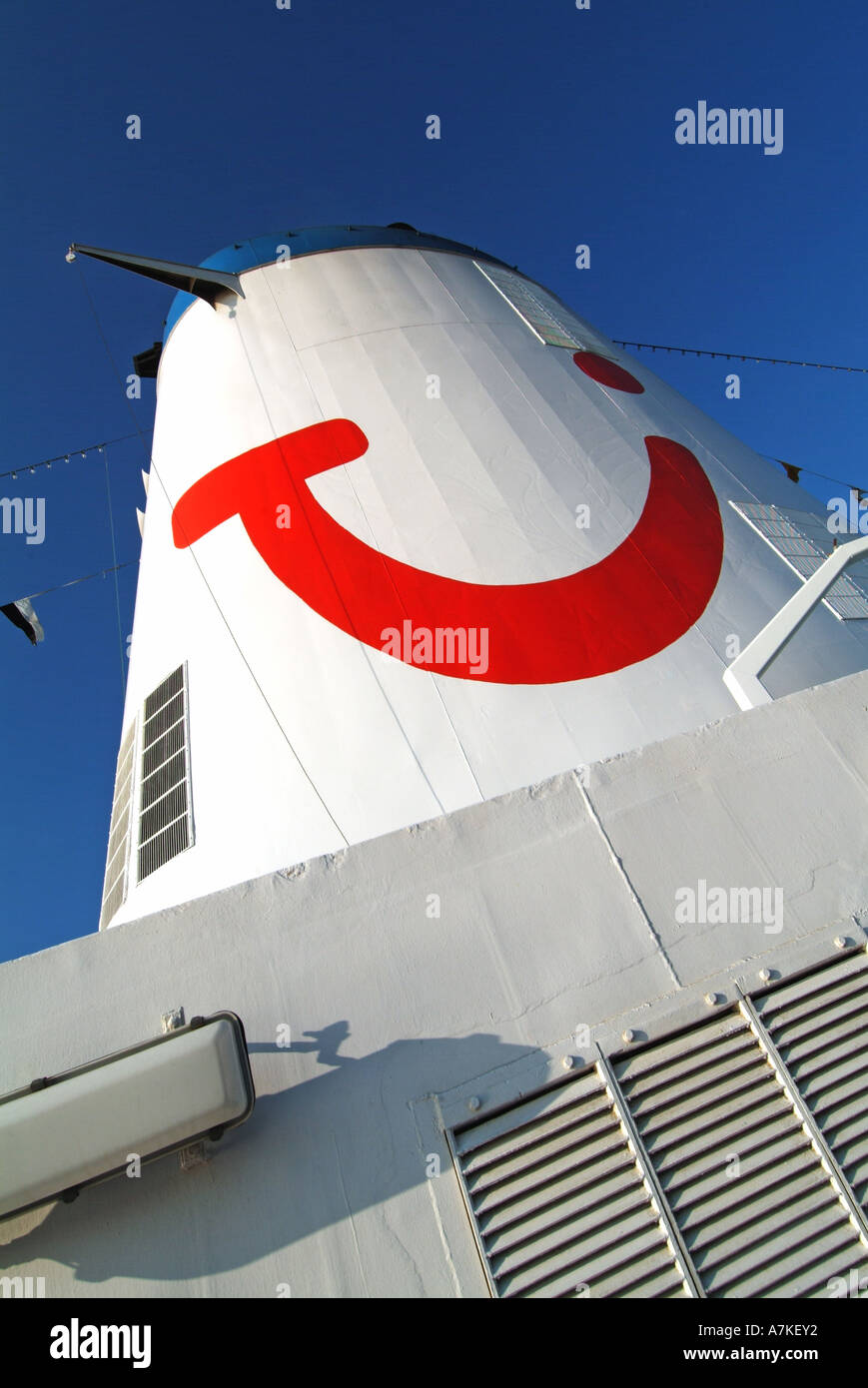 Skywards view of cruise ship funnel with the Thomson logo Stock Photo