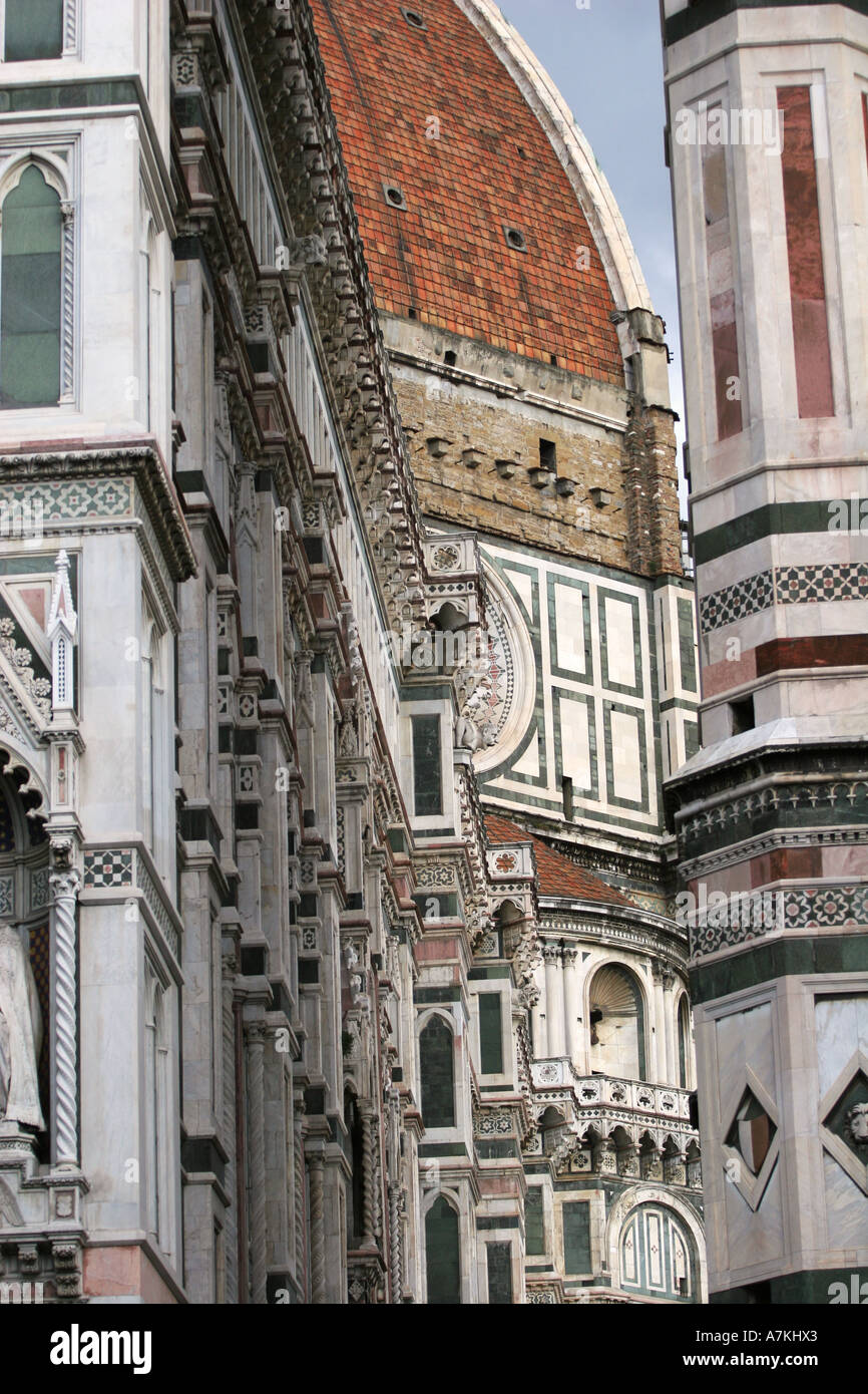 World famous terracotta tiled domed roof of the Duomo in Florence seen through colourful tiled sections of frot facade Italy EU Stock Photo