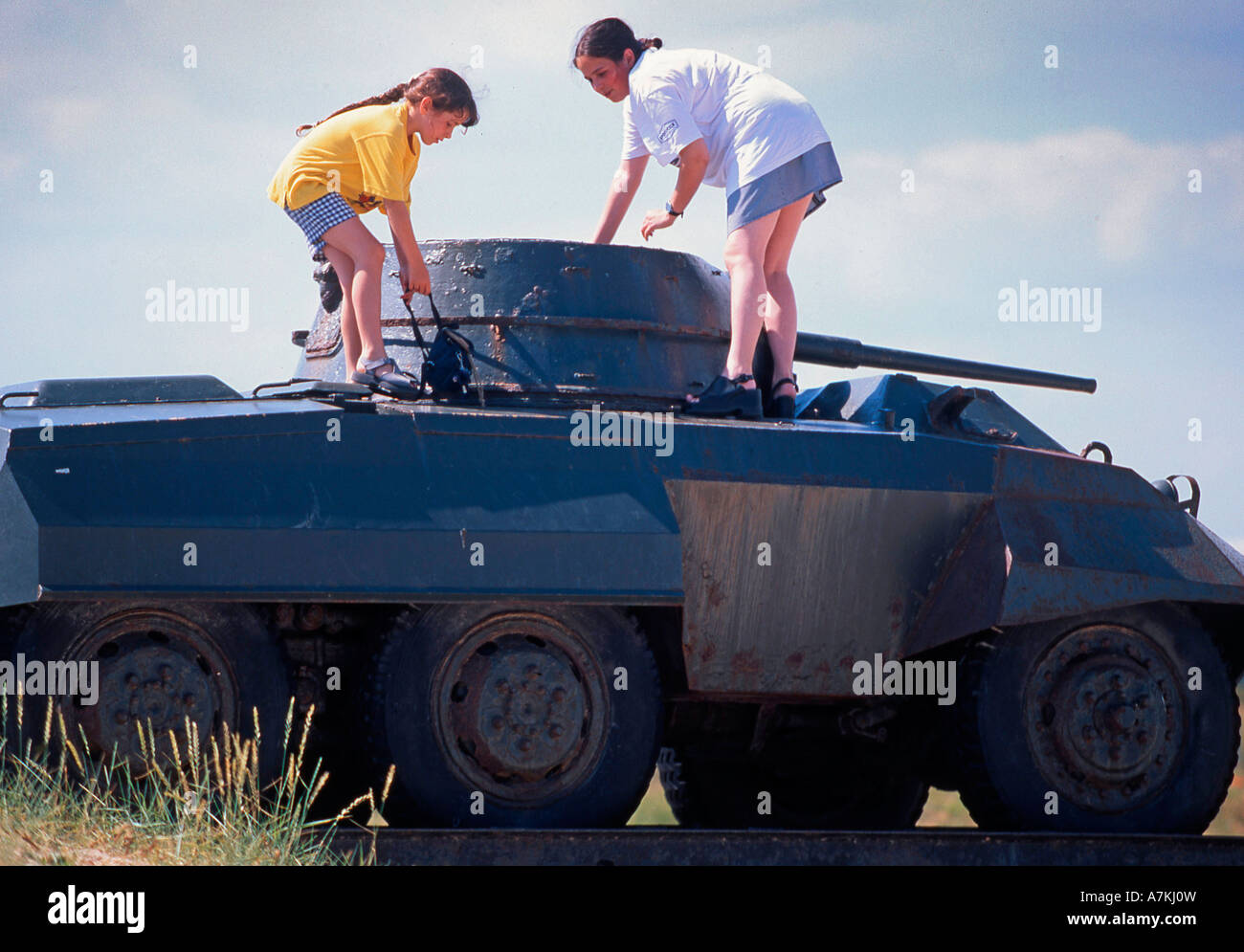 Children playing on top of an old tank Stock Photo - Alamy