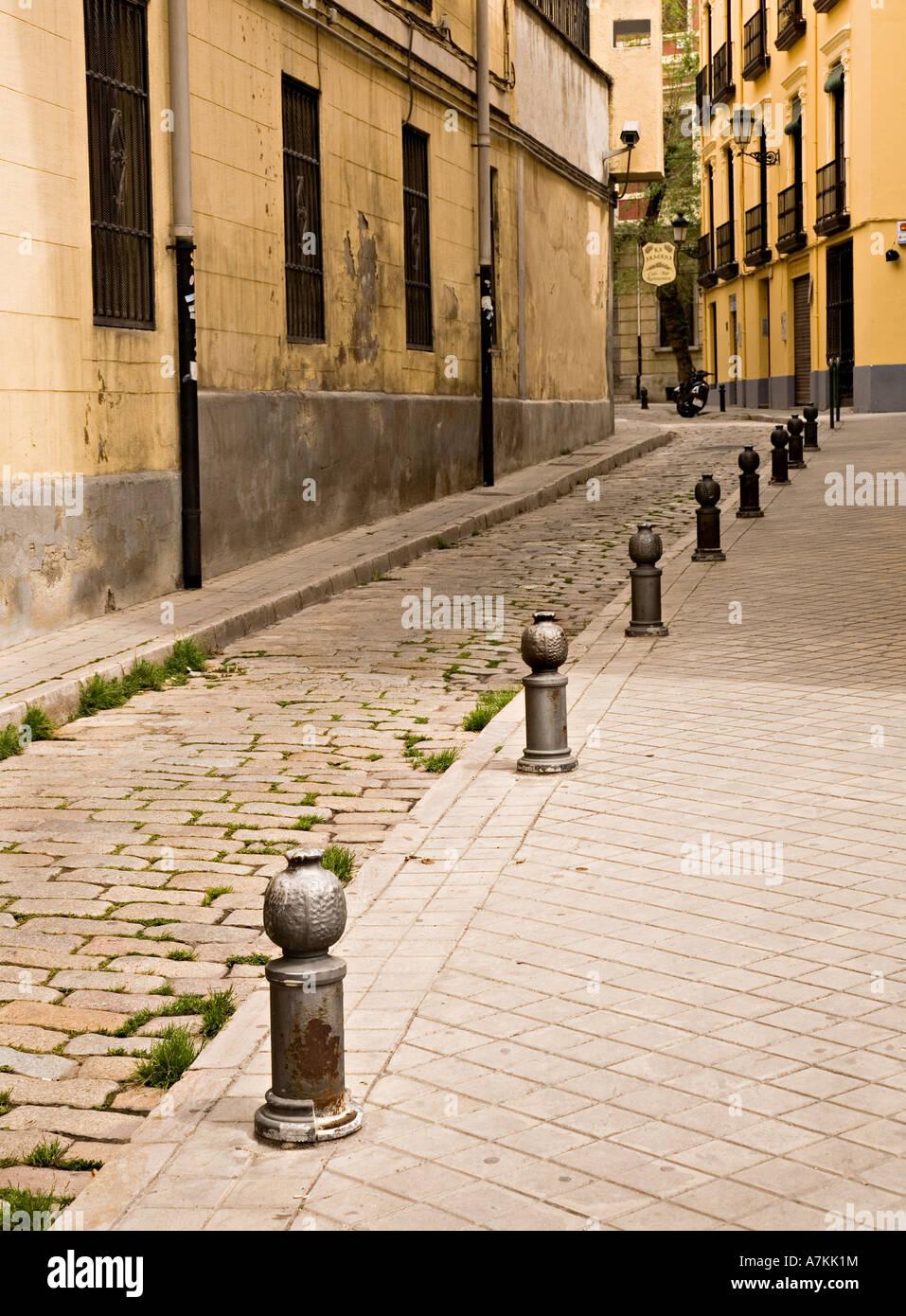 Bollards shaped like pomegranates in cobbled street Granada Spain Stock Photo