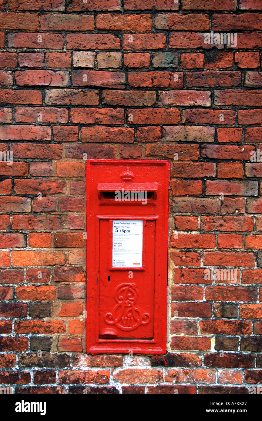 Post box in brick wall Codsall Staffordshire Stock Photo