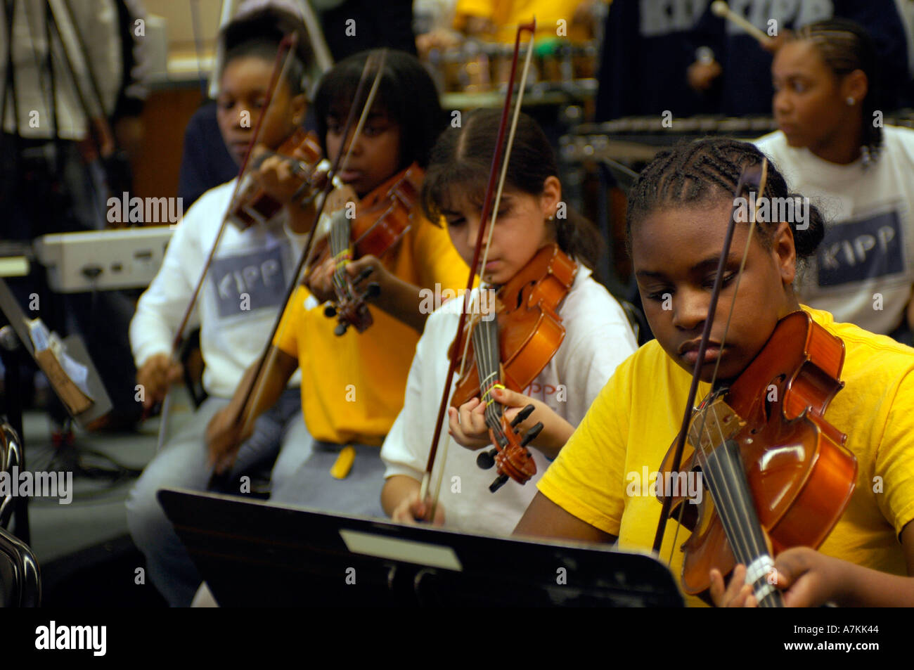 Students in a Sixth grade music class in a Kipp Star charter school in the Bronx NYC practice  Stock Photo