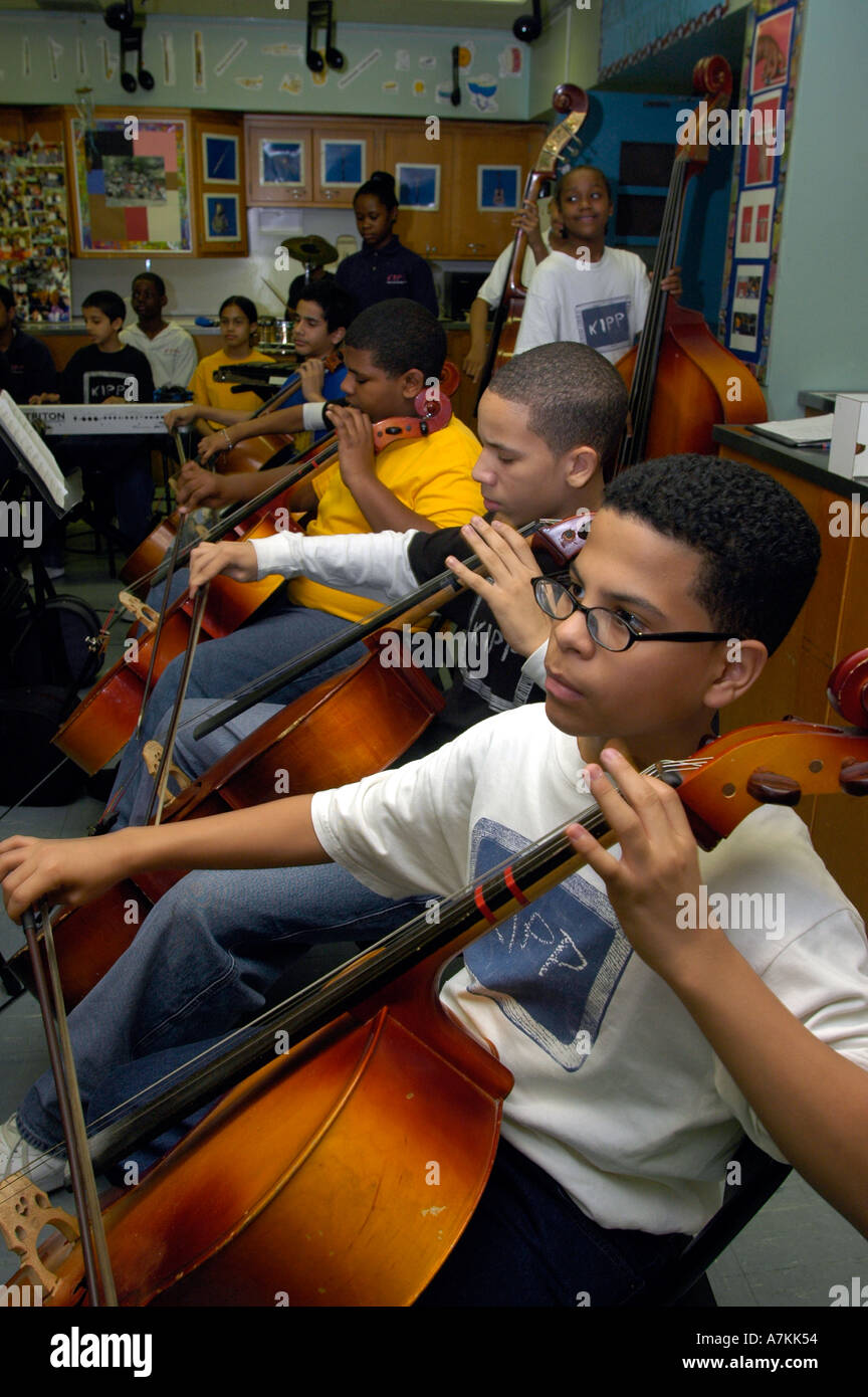 Students in a Seventh grade music class in a Kipp Star charter school in the Bronx NYC practice  Stock Photo