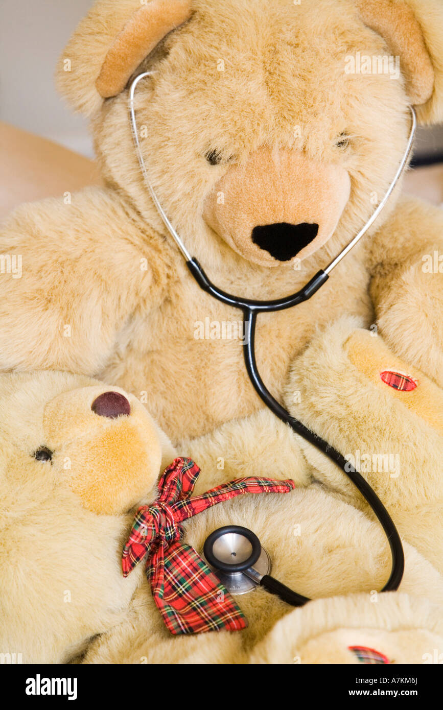 Teddy bears with stethoscope posing as doctor and patient. Ideal to illustrate paediatrics. Stock Photo