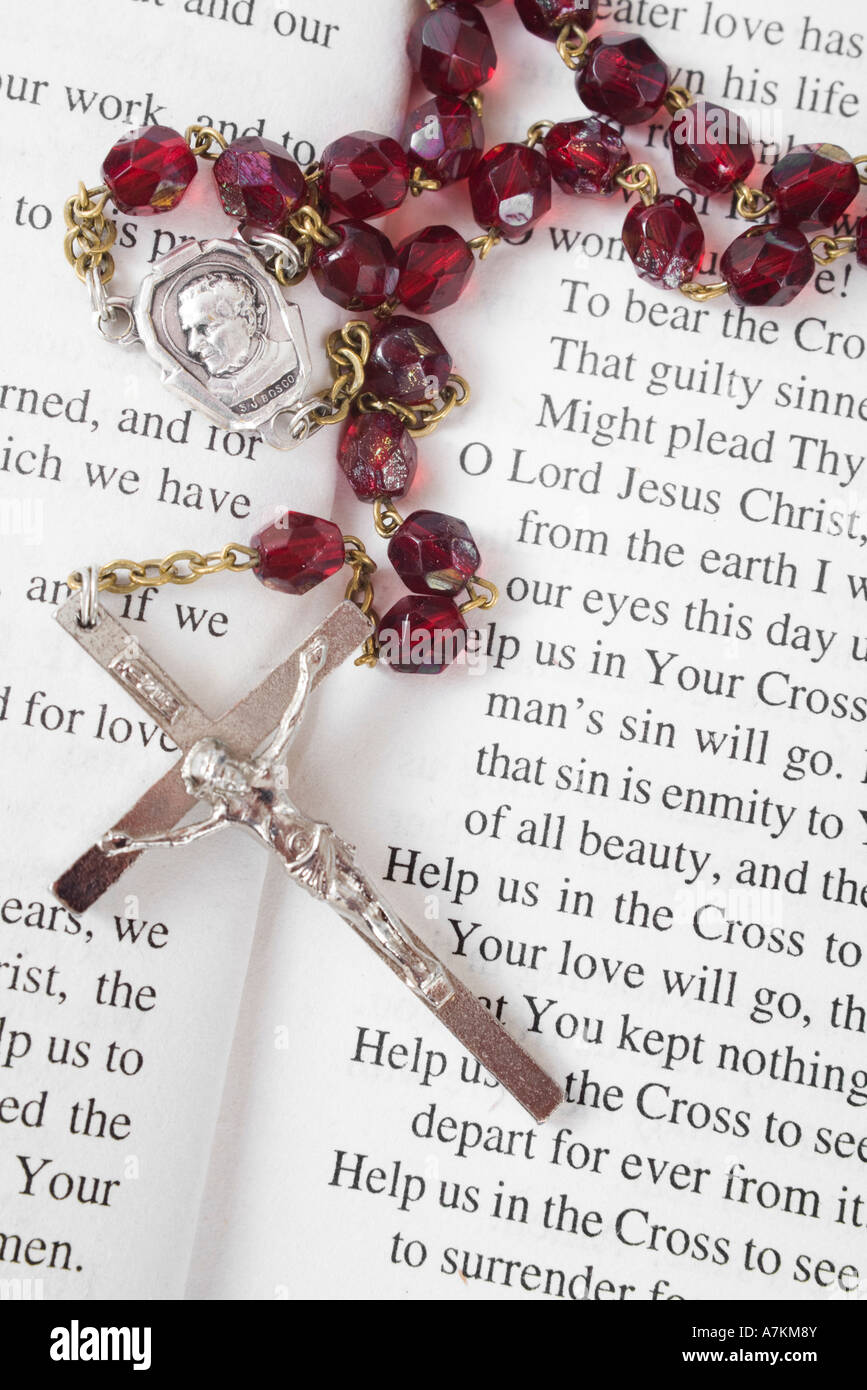 Rosary beads on a book of psalms Stock Photo