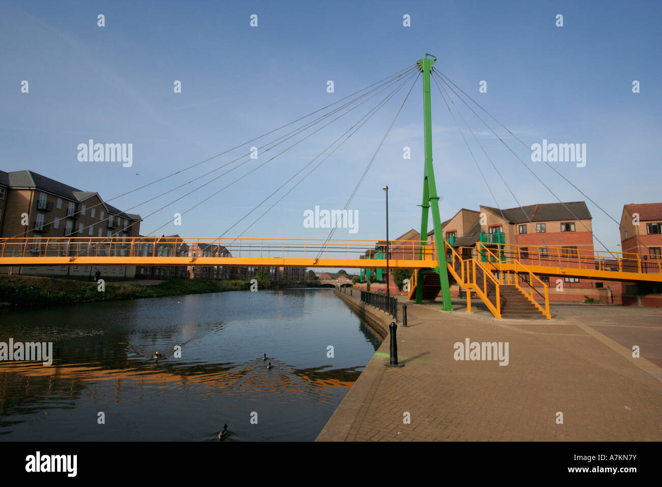 Northampton City Centre cabled stayed footbridge crossing the river nene early morning few people town centre england uk gb Stock Photo