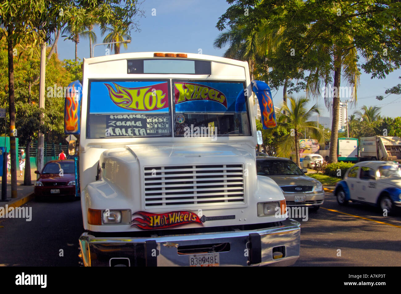 The bus for Caleta making its way down La Costera Acapulcos bay side avenue Stock Photo