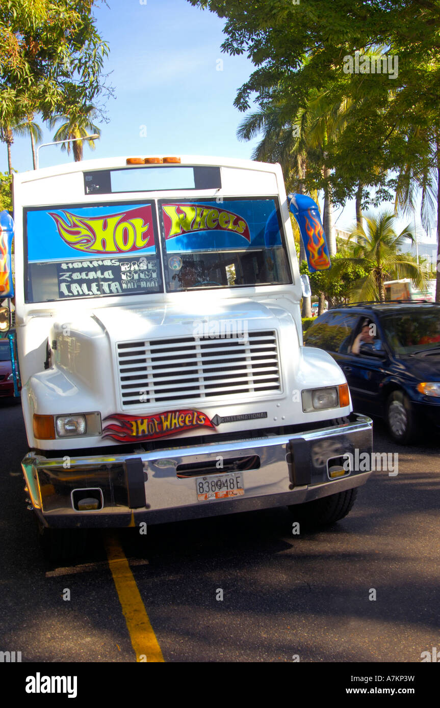 The bus for Caleta making its way down La Costera Acapulcos bay side avenue Stock Photo