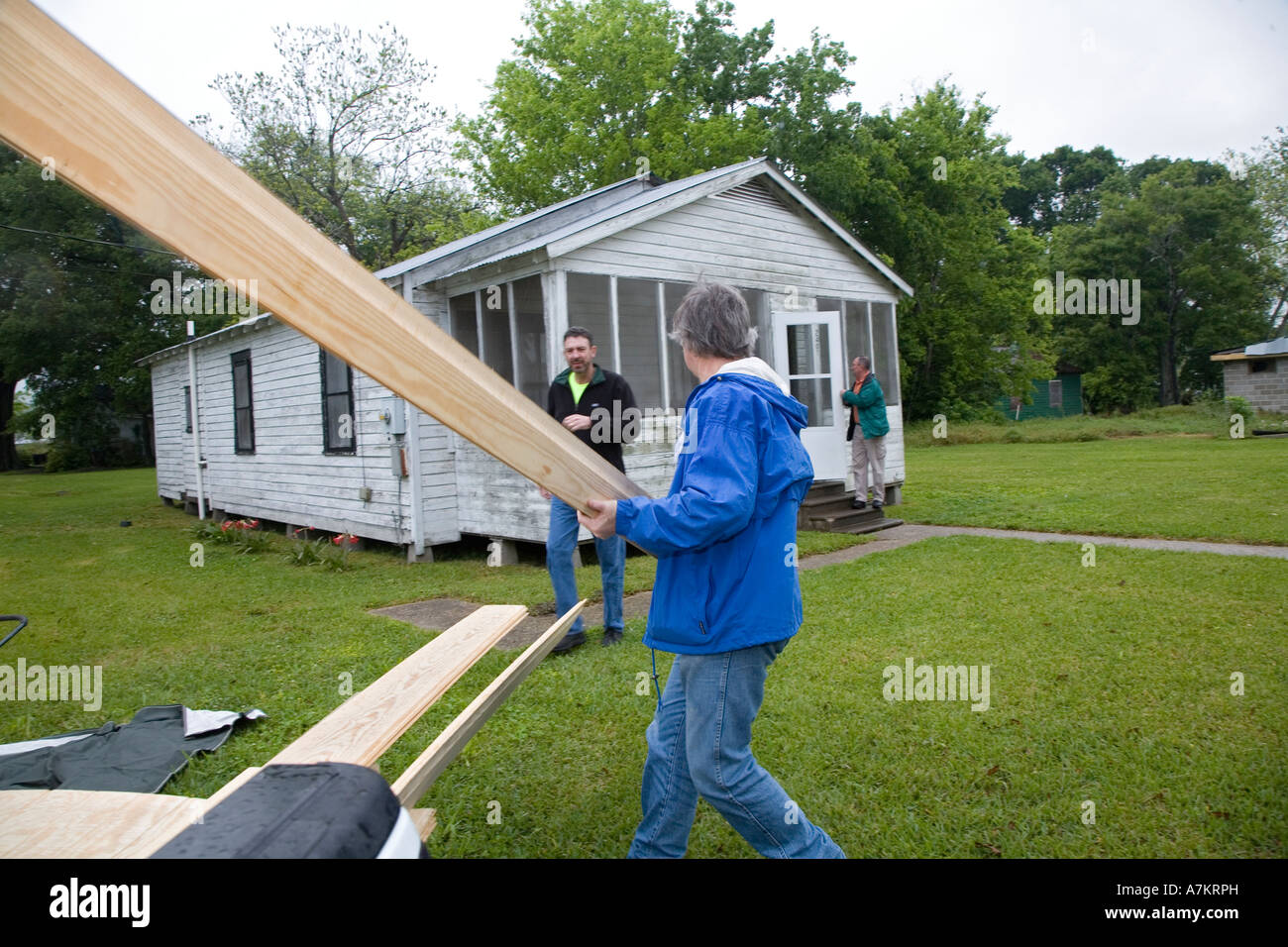 Volunteer Repairs Home for Family Stock Photo Alamy