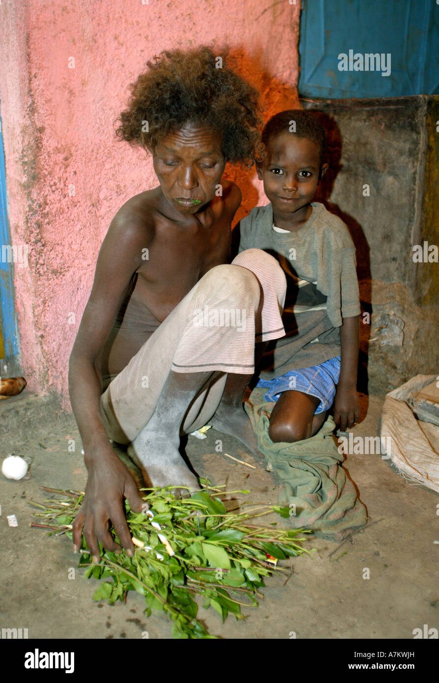 Ethiopia - neglected mother with her son lives on the street and consumes the plants drug Khat Stock Photo