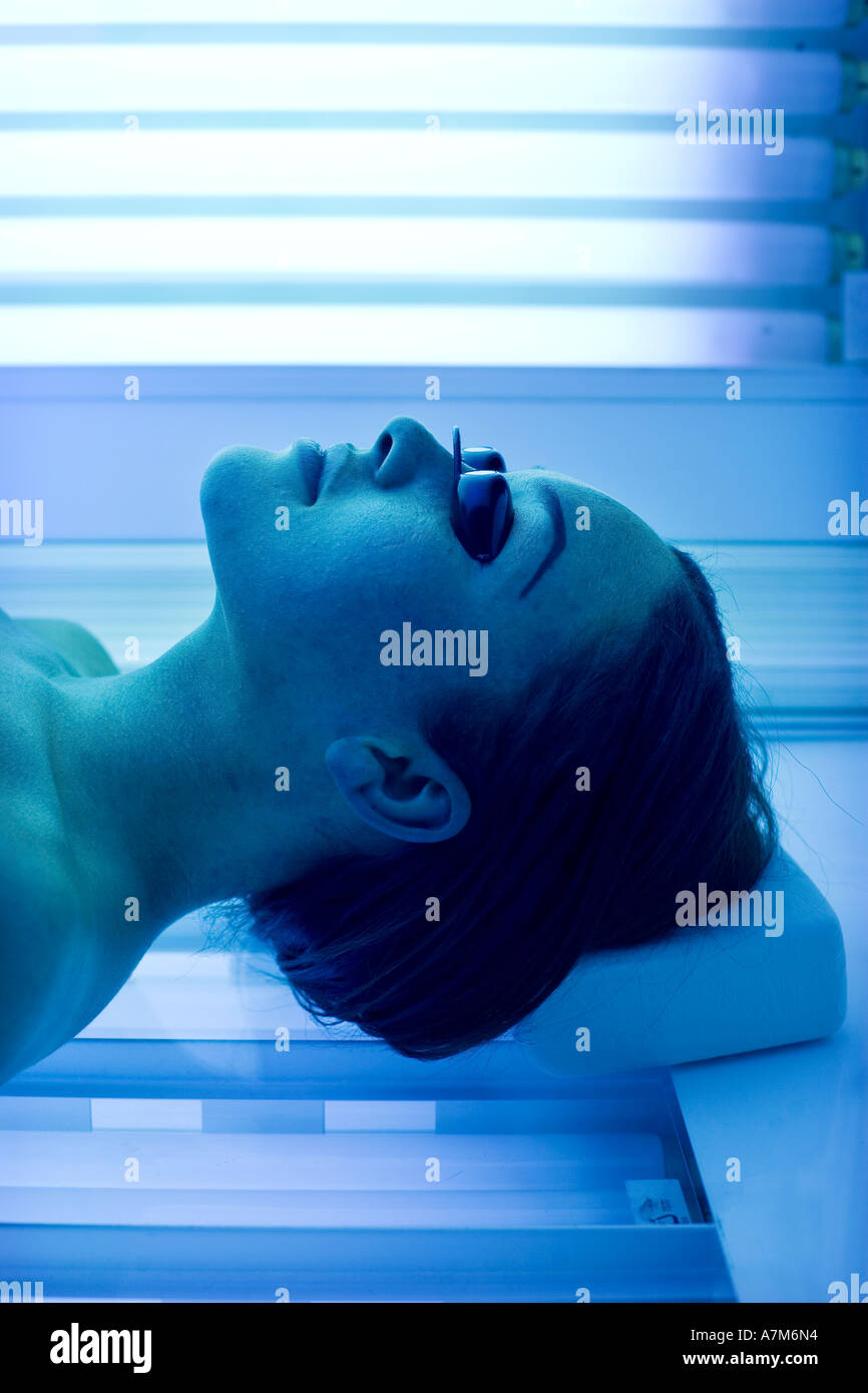A woman in a tanning centre in Birmingham UK Stock Photo