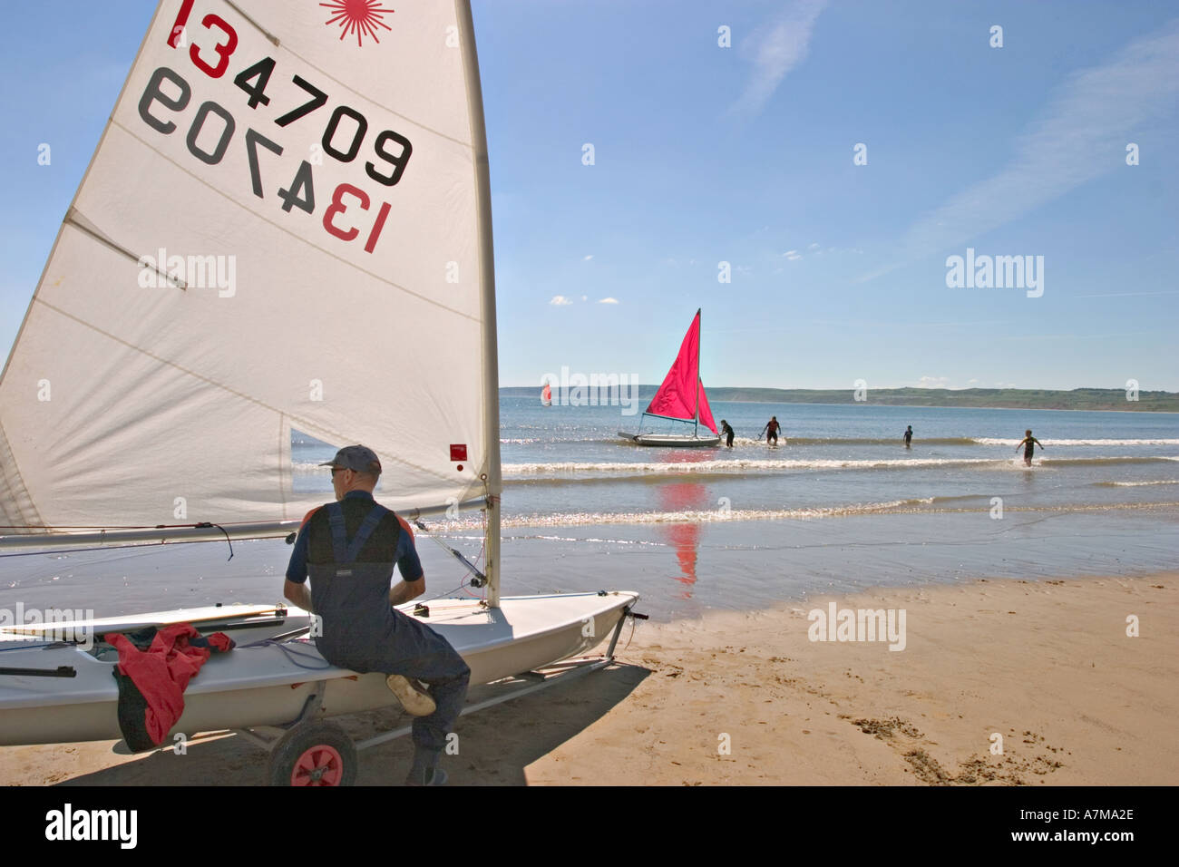 Dinghy and sailor on beach Filey North Yorkshire UK Stock Photo Alamy