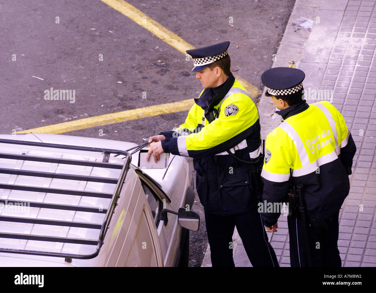 policia local la rambla barcelona spain spanish illegal parking tcikets  police cops two colour color Stock Photo - Alamy