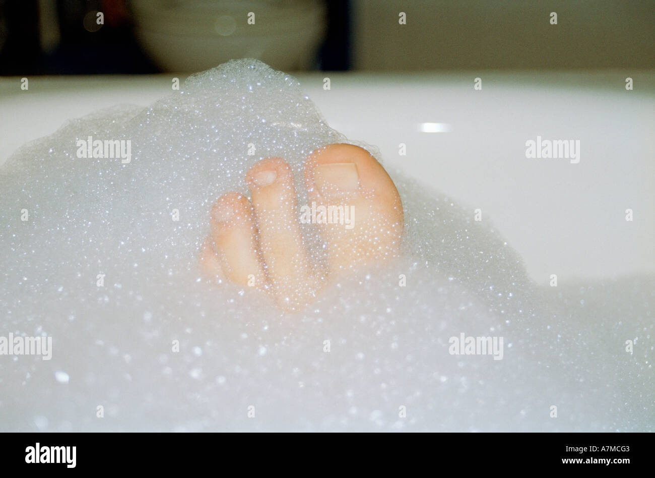 Toes poking out of bubble bath Stock Photo Alamy