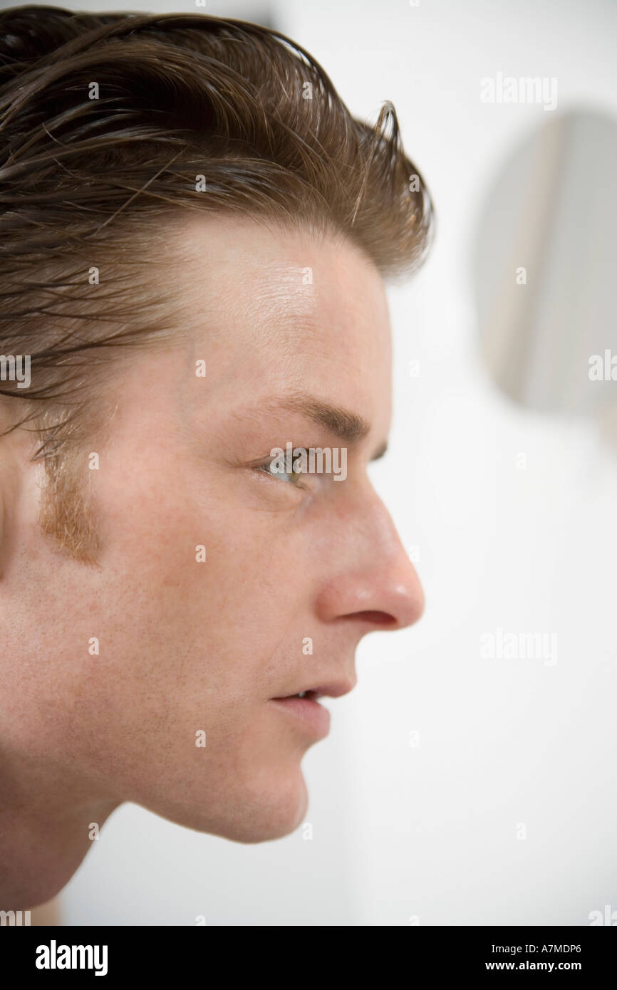 Side view of man looking away Stock Photo