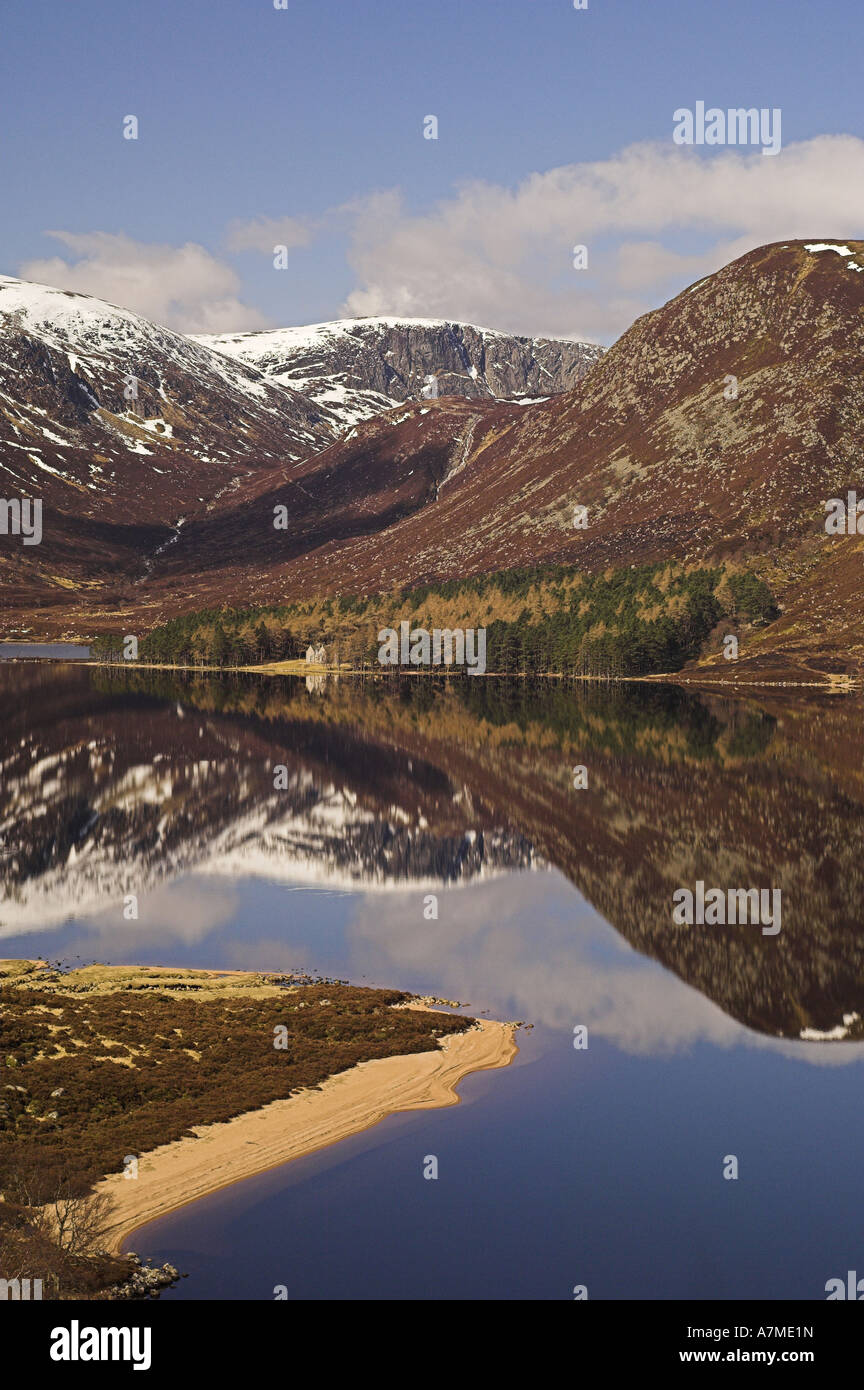 Reflections in Loch Muick, Aberdeenshire, showing Broad Cairn (998metres) and Glas-allt Shiel lodge. Scotland. Stock Photo