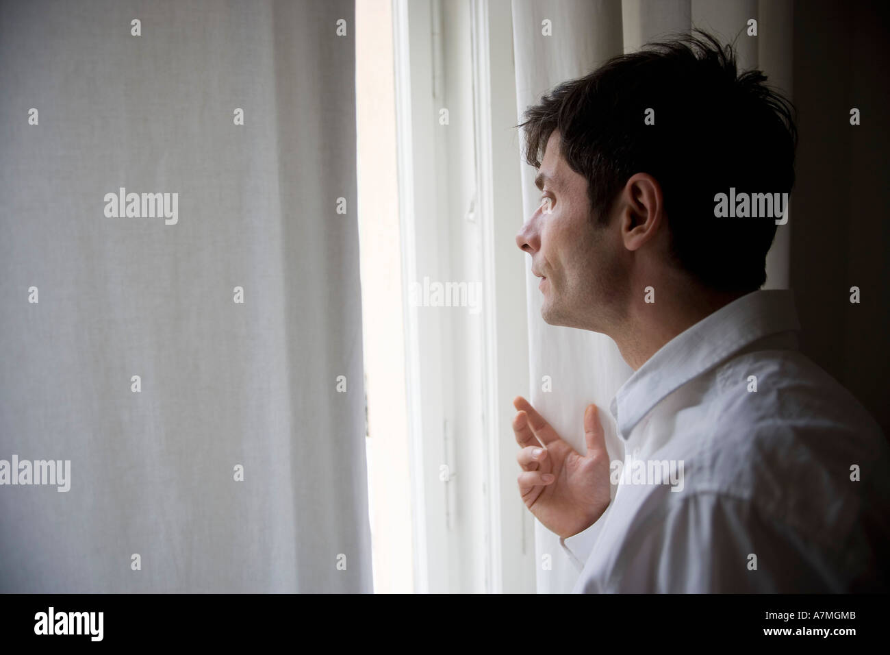 Man at the window hi-res stock photography and images - Alamy
