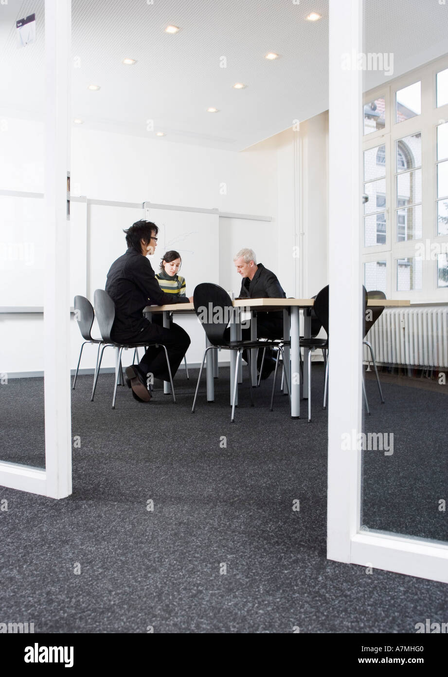 Meeting serious three people hi-res stock photography and images - Alamy