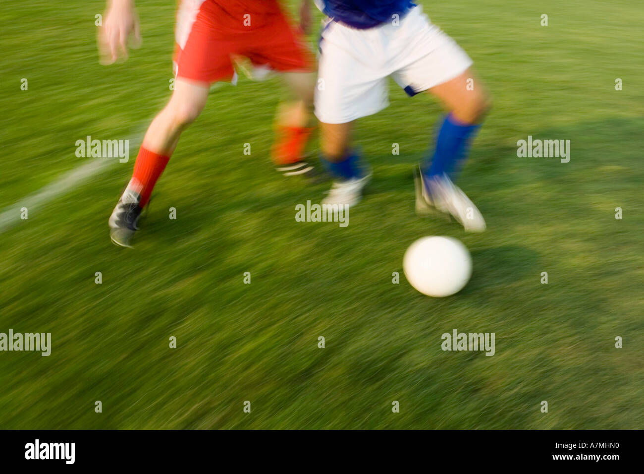 Two people playing soccer Stock Photo