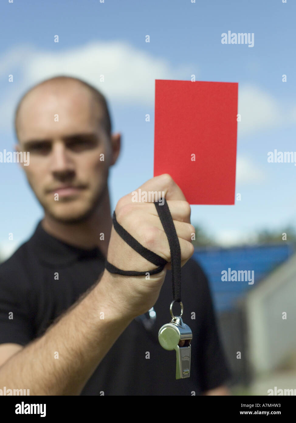 A referee holding up a red card Stock Photo Alamy