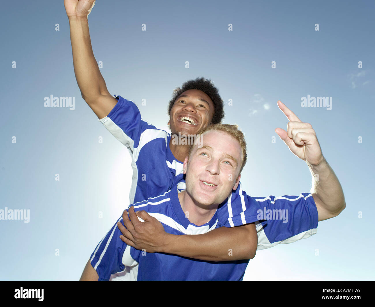 Two soccer players celebrating a victory Stock Photo