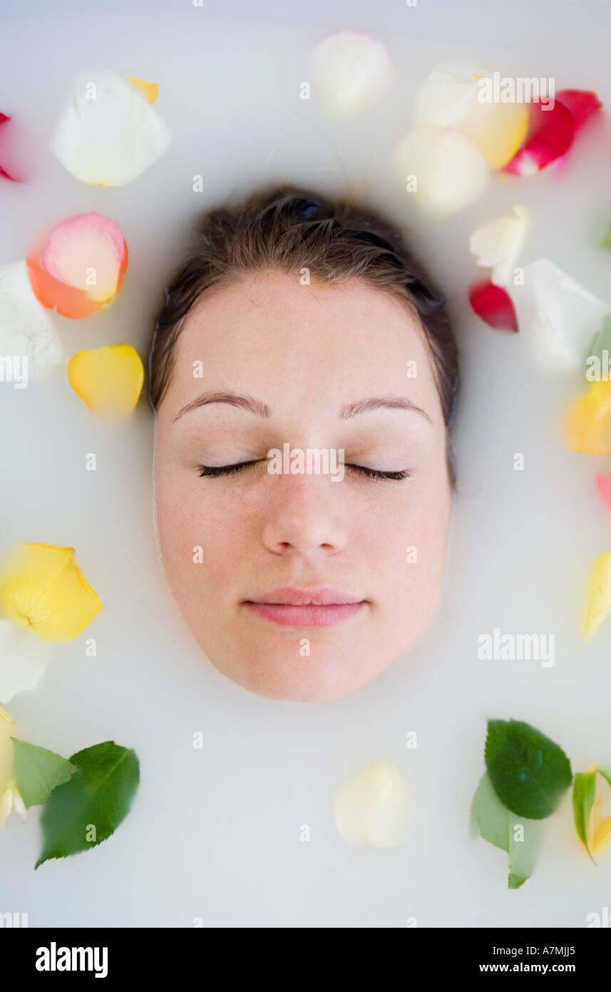 Young woman lying in bathtub hi-res stock photography and images - Alamy