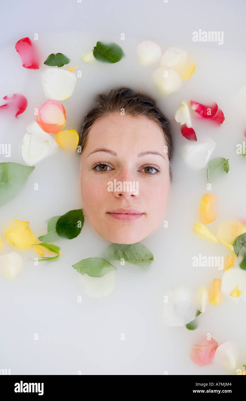 Young woman lying in bathtub hi-res stock photography and images - Alamy