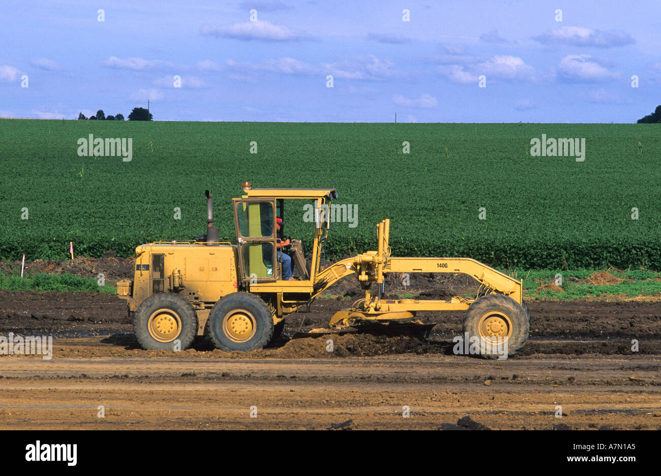 Road grader at road construction along state highway 60 in Northwest Iowa  Stock Photo