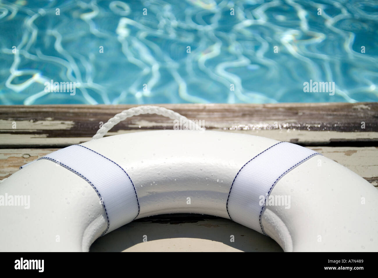 Life preserver on pool deck life jacket Stock Photo Alamy