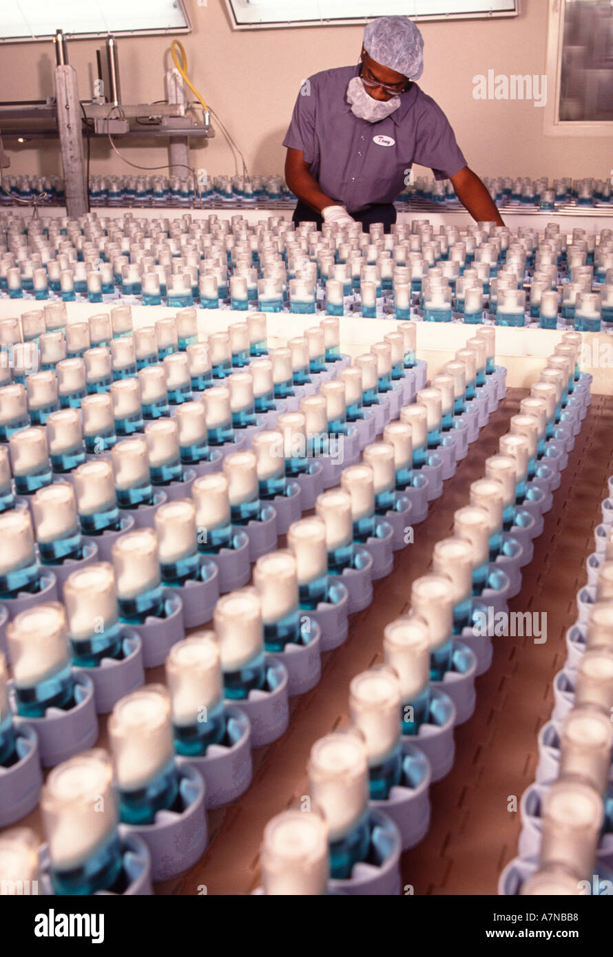 A technician inspects the production of stick deodorant on an assembly line Stock Photo Alamy