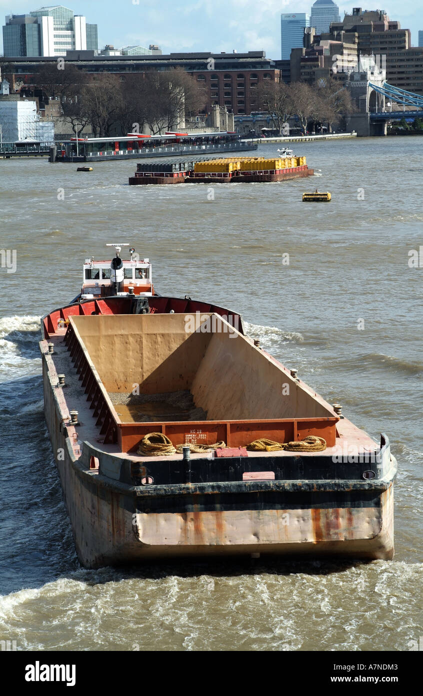 tug towing an empty barge on the River Thames in central London England United Kingdom UK Stock Photo