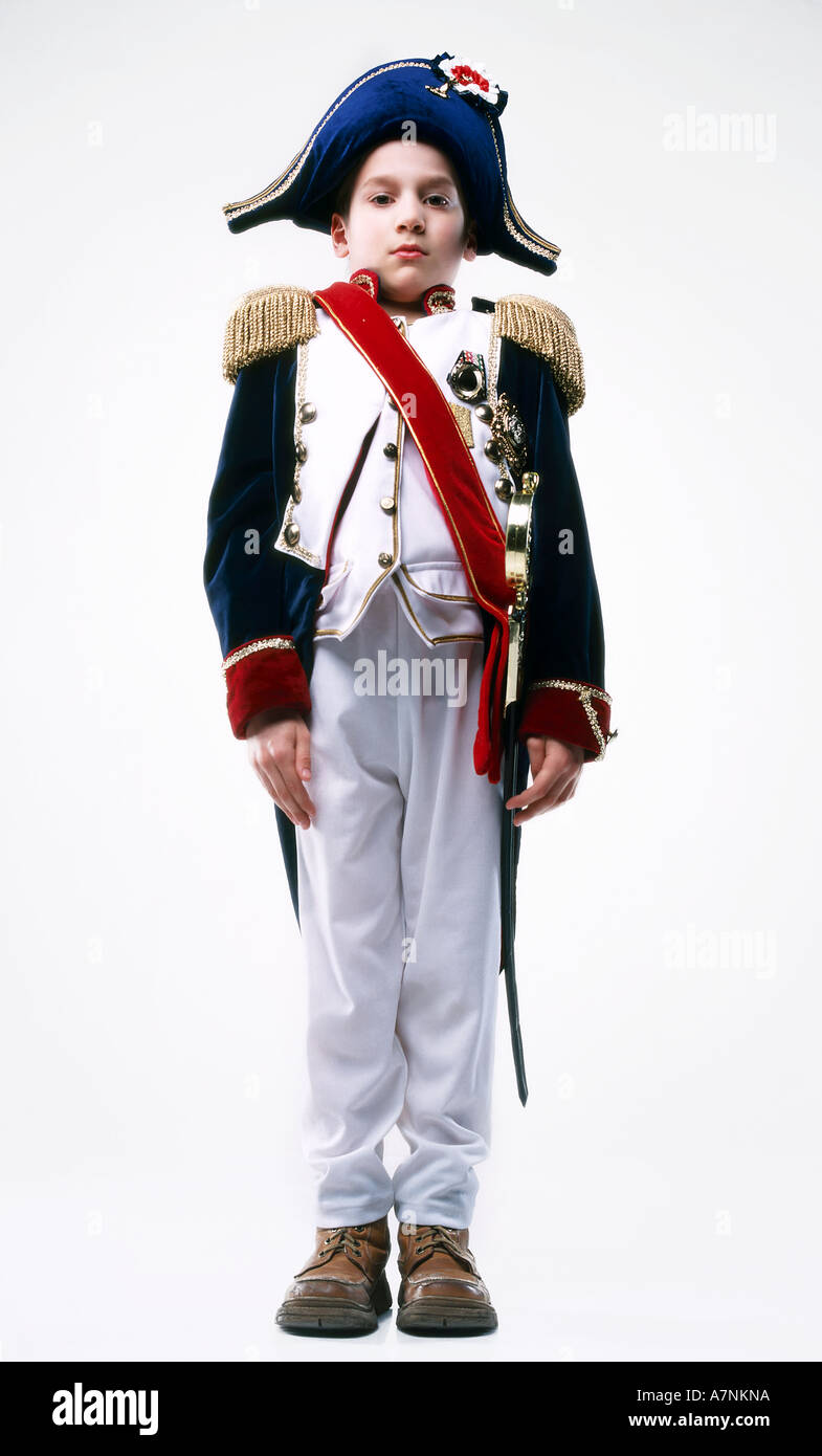 indoor studio child boy 5 10 outfit disguise costume napoleon unifrom  ceremonial battledress sash sabre saber weapon hat cap Stock Photo - Alamy